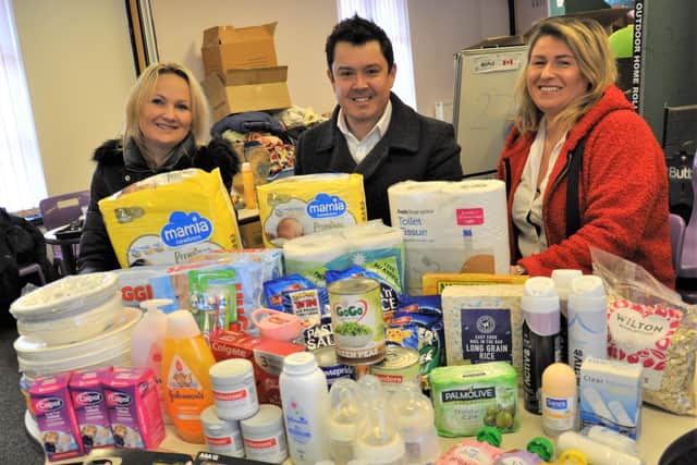 Ewa Romanczuk, Bassetlaw District Council leader Simon Greaves and Ewa Niec with the type of items needed for the refugees.