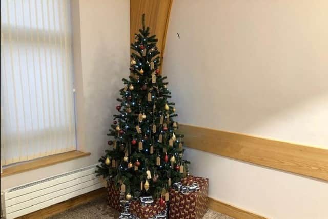 A Westerleigh Group Christmas tree with memorial tags