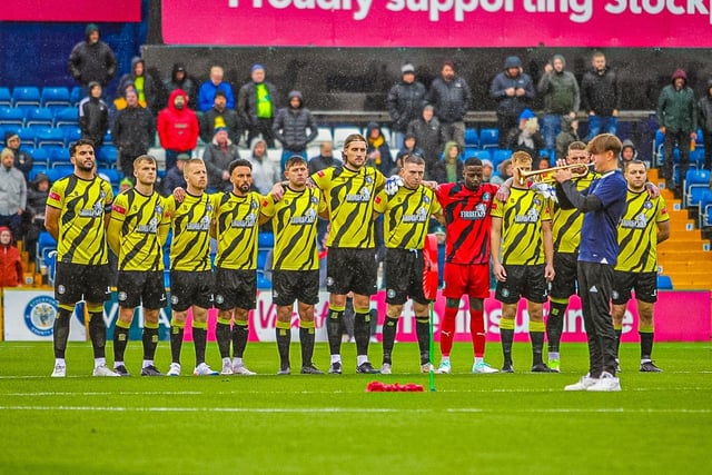 Tigers lining up to respect Stockport County's pre-match Remembrance Day ceremony.
