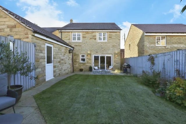 The back garden is secure and enclosed, and includes a well-maintained lawn