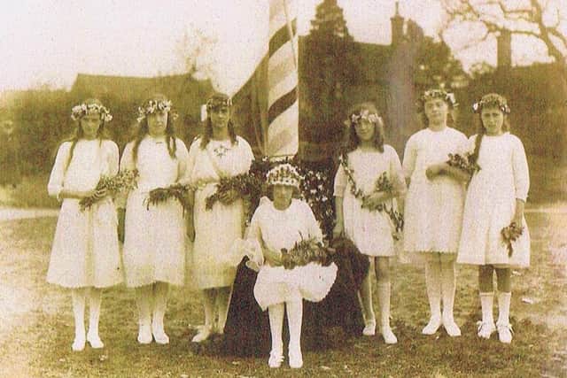 Flashback to 1923, the first year of recorded and documented maypole dancing in Wellow. This photo shows the crowning of the May queen, Mabel Bowman, and her retinue.