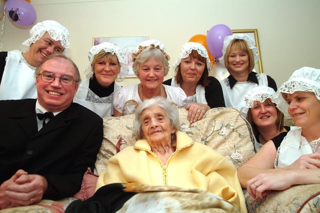 Staff at the Sherwood Grange Care Home, Mansfield Road, Edwinstowe, celebrate the 100th birthday of resident Linda Cooper with a party and dressed up for the event in servants' costumes in the style of 100 years ago .
