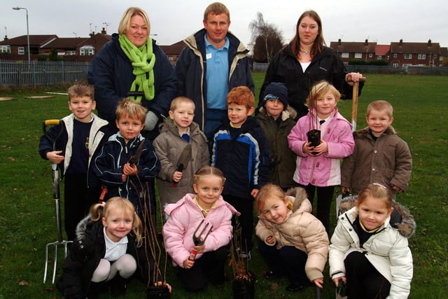 Nursery children from Manton New Primary get ready to plant new trees with L-R Lesley Reekie (foundation stage team leader), Neil Dashper (ND Services, landscaping specialist) and Rachel Bristow (Bassetlaw training agency student).
