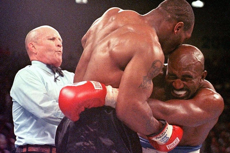 The heavyweights met in 1997. The bout had a bad-tempered start after Holyfield caught Tyson with a headbutt. Iron Mike's reaction was to bite a chunk out of his opponent's ear, earning a round 3 loss, a $3 million fine and a disqualification from boxing.