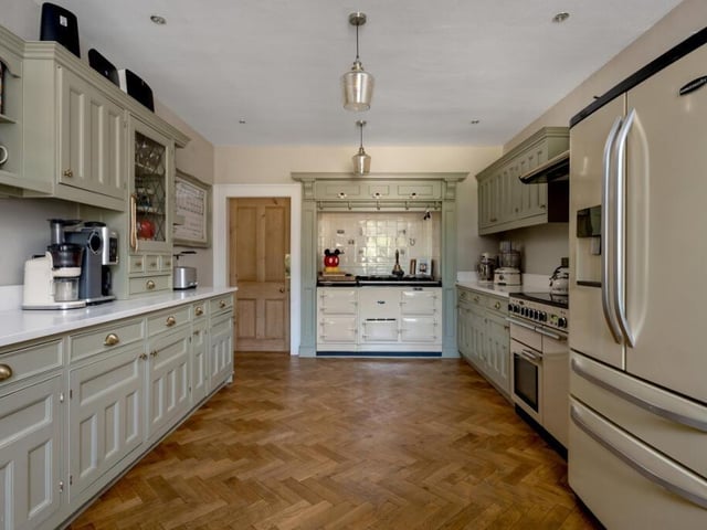 The kitchen, with hand-crafted cabinets and an Aga.