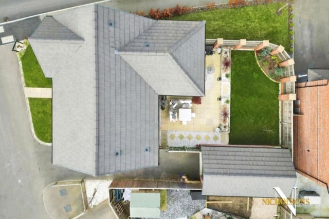 The last image in our gallery is a revealing overhead drone shot, showing the property and the plot it stands on.
