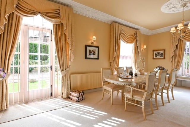 An elegant dining area is surrounded by brightness, including from a patio door that leads to the side of the £849,500 property.