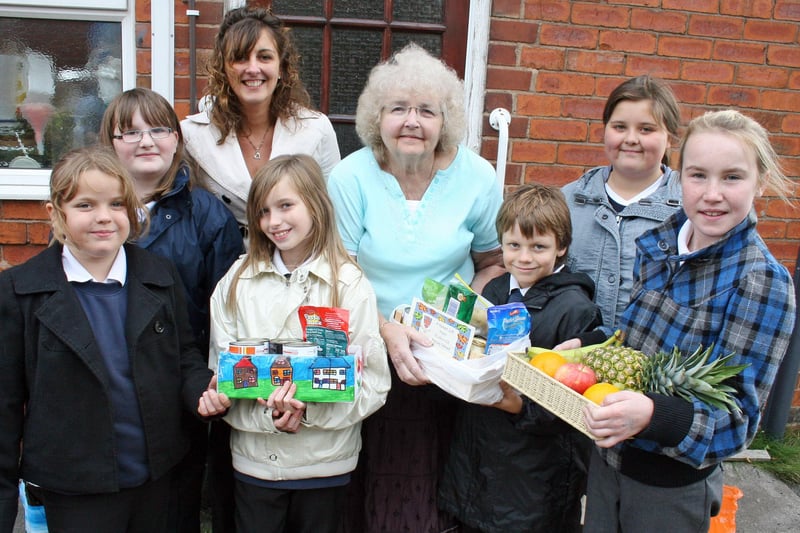 Ripley St John's school pupils Jessica Sykes, Chloe Marriott, Lilly-Mae Holmes, Richard Taylor, Emily Musgrove and Millie Wightman hand out produce from their harvest festival in 2009.
