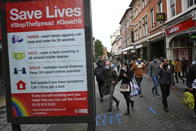 A board displaying information on how to restrict the spread of Covid-19 in central Nottingham in October 2020. (Photo: OLI SCARFF/AFP via Getty Images)
