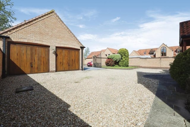 From the front, a gate opens on to this courtyard where you will find a fine detached, brick-built double garage.
