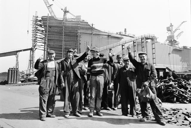 Workers at South Docks yard of Austin and Pickersgill cheer after hearing the news they had won the Queens Award to Industry for export achievement in 1974.