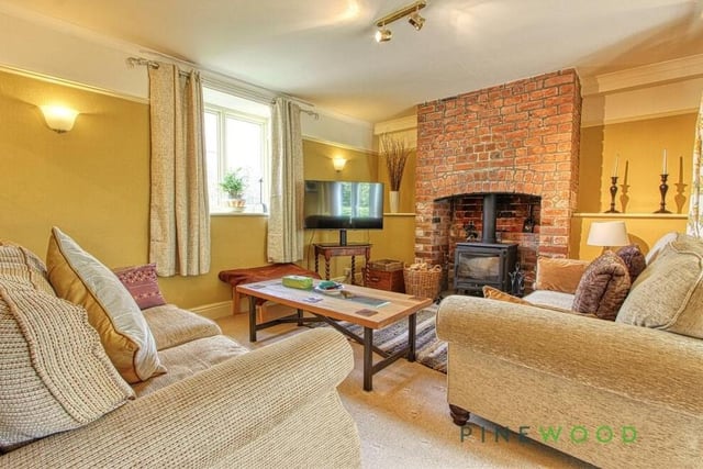 Let's begin our tour of the £725,000 Whitwell property in this lovely and spacious lounge. Your eye is instantly drawn to the traditional feature fireplace with multi-fuel burner.