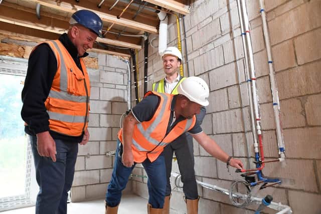 Bellway customer Paul Phillips inspects his new home at the 'pre-plaster' visit. (Photo by: Bellway Homes)