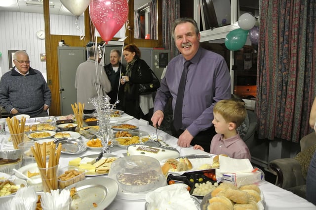 Alan Whyles cut his retirement cake with help from seven-year-old grandson Owen back in 2013