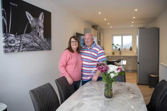 Judith and Steve in their spacious open-plan kitchen and dining room which they love cooking in.