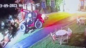 Video grab from CCTV from The Mucky Duck pub where a stolen digger was repeatedly rammed into the building