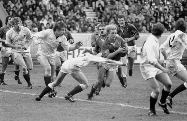 Dusty Hare (#15) tries to stop French captain Jean-Pierre Rives in 1980 during England v France in the Five Nations rugby tournament. (Photo by JEAN-CLAUDE DELMAS/AFP via Getty Images)