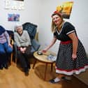 Greenacres Grange care home has opened up a bar thanks to a donation from a resident's family. Seen activity coordinator Tracey Pressley with residents and famalies in the new bar.
