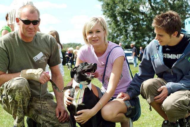 In 2007 Rocky the Staffordshire labrador cross shows off his collar and tie during the dog show at the Mansfield Woodhouse vets clininc with owners from left, Paul Pepperday, Katy Pepperday and Jonathan Scott