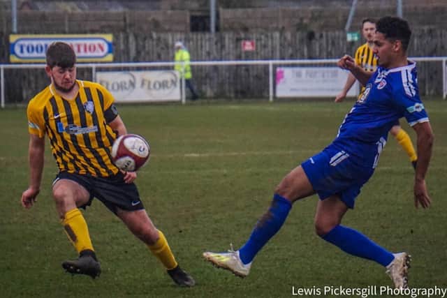 Atherton clears the ball away against Sutton Coldfield Town. Pic by Lewis Pickersgill.