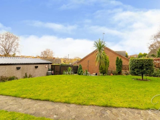 The stunning back garden features an excellent, extensive lawn, with surrounding mature shrubs and trees.