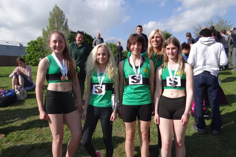 The Worksop Harriers Under 15 girls relay team, and Amy Fendley, coach and long jump champion
