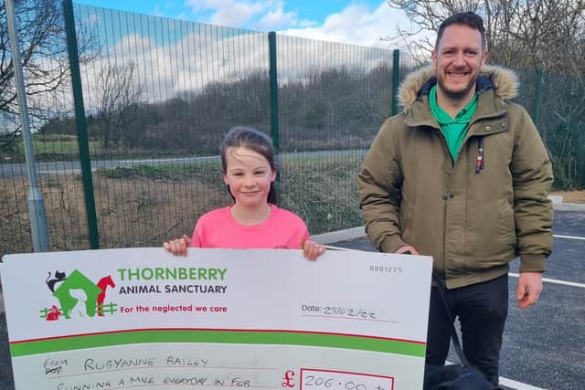 Rubyanne raised £200 by running the distance of a marathon in just 23 days. Pictured with Thornberry's fundraising manager, Ged Jenkins-Omar.