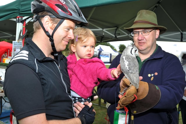 Jim Bratherton with his 19-month old daughter Beth, meet a bird from Raptor Foundation at the Chesterfield Canal Festival in Worksop in 2010.