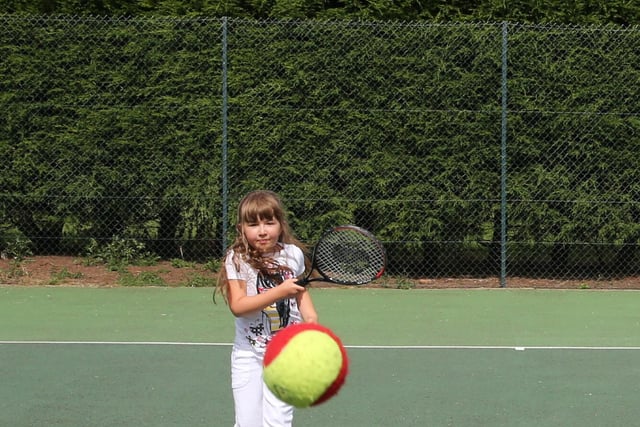 Millie Parry (8) gets to grips with tennis