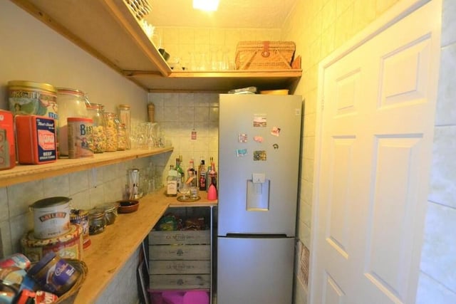 Just off the kitchen at the £450,000 property is this useful pantry, which has shelves for food and drink storage.