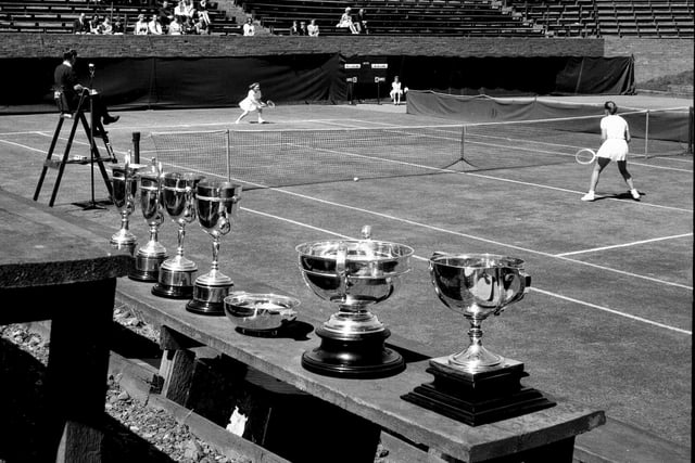 Trophies on display at Craiglockhart as Miss Veronica McLennan takes on Miss Majorie Love in the tennis championships in 1965.