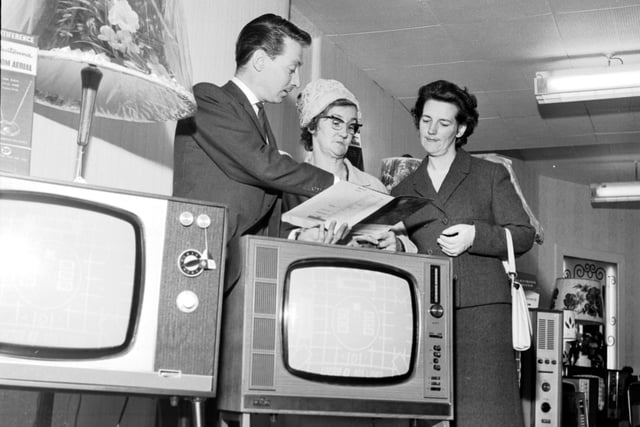 An Evening News & Dispatch 'Find the Ball' competition winner uses her 'Shopping Spree' prize to buy a television set at Telectra House in Great Junction Street, Leith, in June 1966.