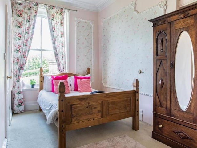 A more compact bedroom, but no less cool because of it. Again, it is bright and with a high ceiling.