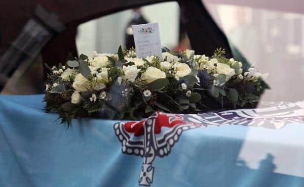 Sgt Saville's coffin was draped in the Nottinghamshire Police colours and a wreath placed on top. Photo: Nottinghamshire Police
