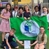 Youngsters at the school celebrating their eco achievements