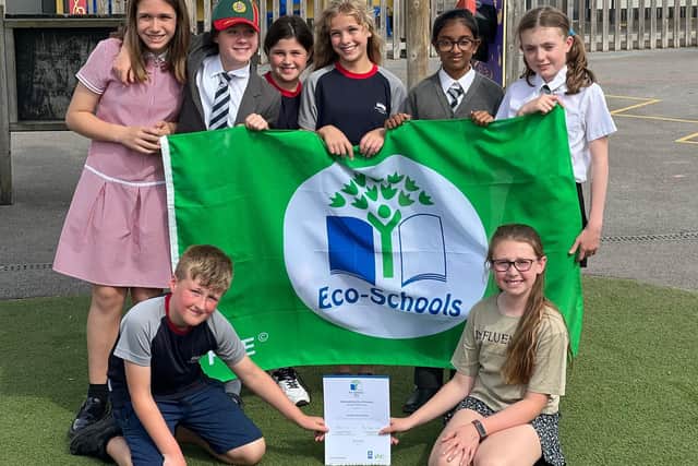 Youngsters at the school celebrating their eco achievements
