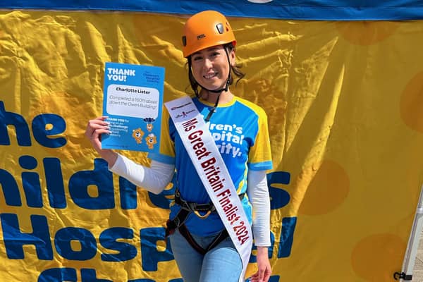 Charlotte Lister completes 160ft abseil for charity