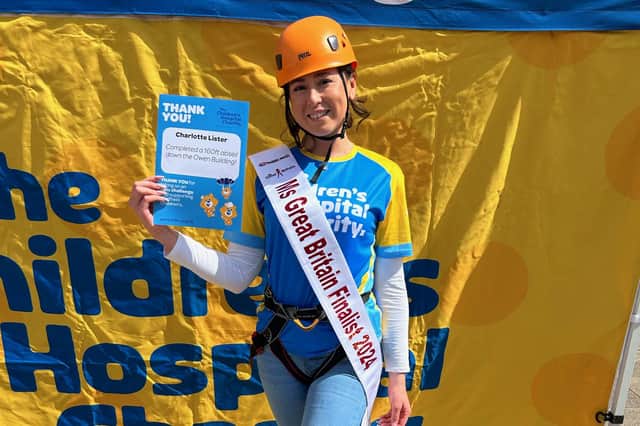 Charlotte Lister completes 160ft abseil for charity