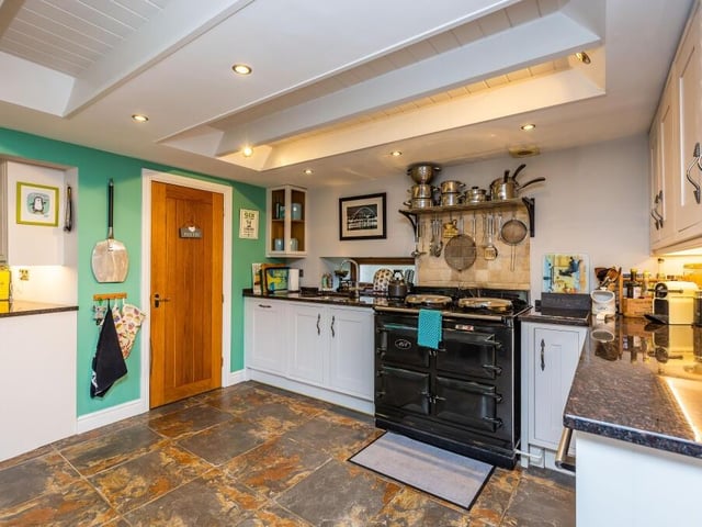 Next stop on our tour of The Old Barn is this magnificent kitchen and breakfast room, at the centre of which is an Aga cooker.