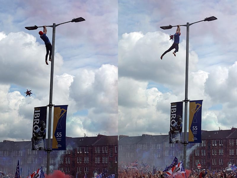 A Rangers fan clings on to a lamp post outside the ground during the Scottish Premiership match at Ibrox Stadium, Glasgow. Picture : Robert Perry/PA