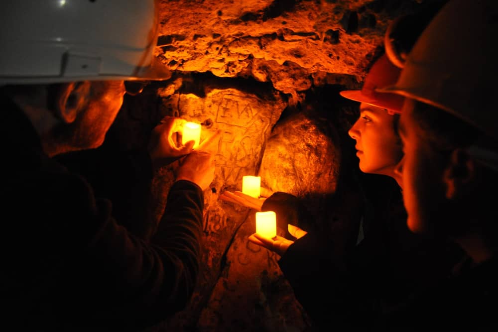 A guided tour showing the Witch Marks in Robin Hood Cave at Creswell Crags.