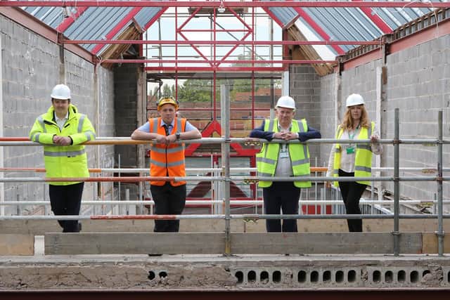 Bassetlaw District Council leader Simon Greaves, site manager Conrad Cousins, chief executive Neil Taylor and project manager Jane Harrison in the Bridge Court project.