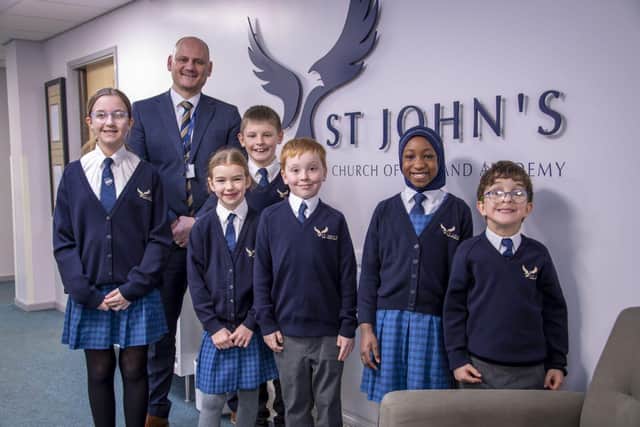 Mr Gez Rizzo, Principal of St John’s C of E Academy with children.