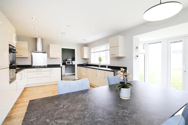 We begin our tour of the Shireoaks stunner in this modern kitchen/diner, which is fitted with a range of cream gloss wall and base units. Integrated Zanussi appliances include a double oven with five-ring hob, fridge/freezer and dishwasher.
