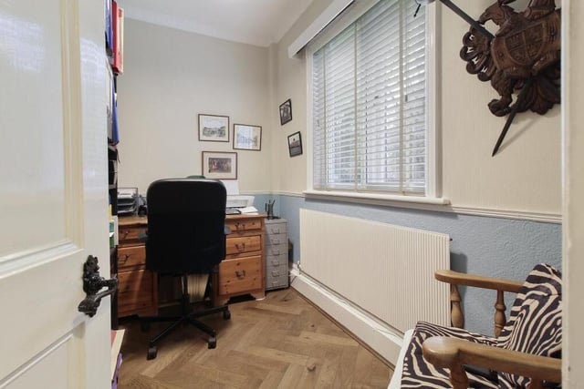 This study or home office might be compact but it is a valuable addition to the ground floor and is a versatile space too. It is blessed with an ornate, coved ceiling and a walnut parquet floor. The window faces the front of the house.