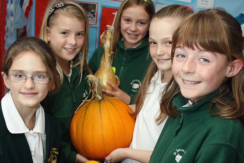 St John's Primary School pupils Amy Northbridge, Isobel Lea, Becky Waldron and Natalie Peake with harvest festival produce in 2009.