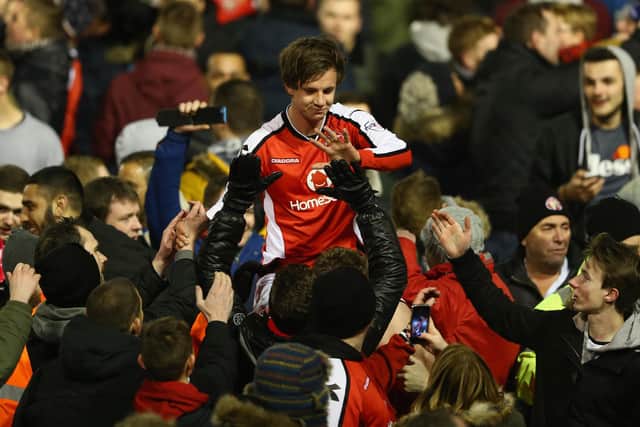 James Baxendale of Walsall is carried off the pitch on a supporters shoulders after his side reach the final after an aggregate 2-0 victory during the Johnstone's Paint Northern Area Final second leg match between Walsall and Preston North End at Banks' Stadium on January 27, 2015 in Walsall, England.  (Photo by Michael Steele/Getty Images)