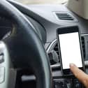 Mobile phones being used in a car to navigate must by appropriately mounted