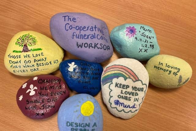 People are being encouraged to paint messages on pebbles.