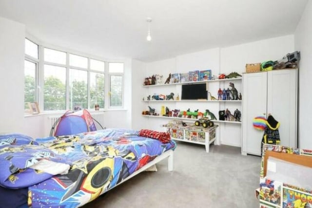 This bright and colourful bedroom is currently paradise for a child! A large bay window overlooks the front of the Doncaster Road house.